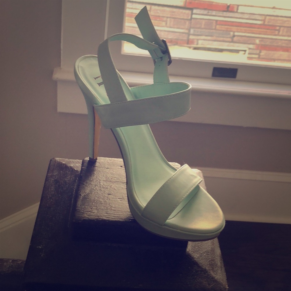Light teal heels. Never worn.